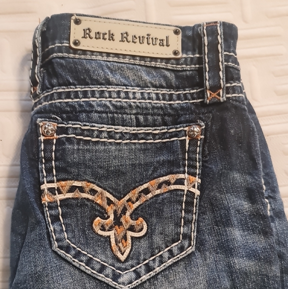 Rock Revival Blue Jeans with Vintage Faded Look